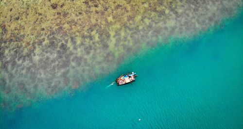 High angle view of people on boat in sea