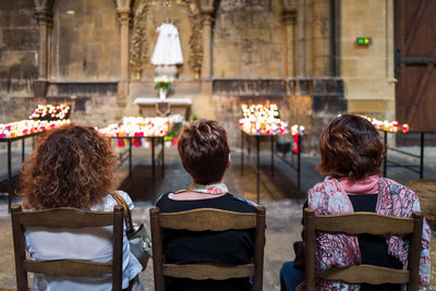 Rear view of people sitting in church