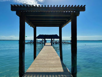 Pier over sea against sky