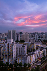 High angle view of buildings in city against sky during sunset