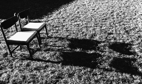 Shadow of chair on grass