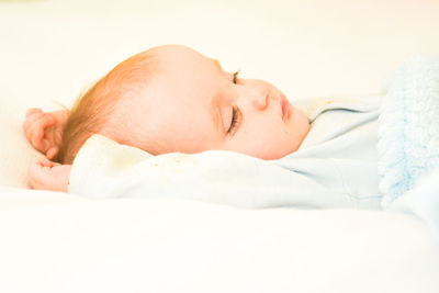 Cute baby sleeping on bed