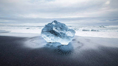 Scenic view of sea against sky during winter