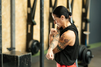 Young woman exercising in gym