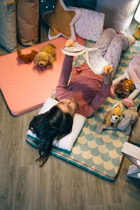 High angle view of woman sitting on table