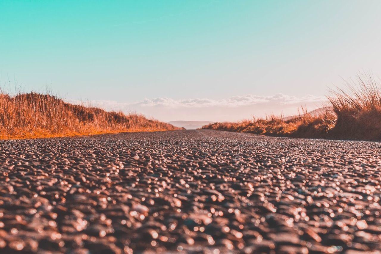 SURFACE LEVEL OF ROAD AGAINST SKY