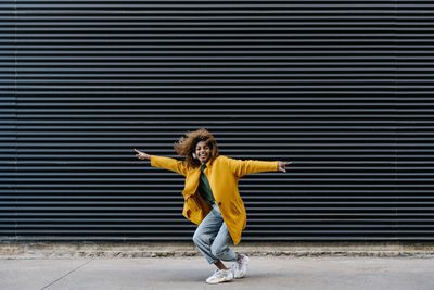 Full length of a woman standing on field