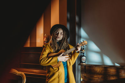 Young woman playing guitar