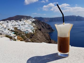 Close-up of coffee on table against mountain