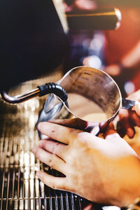 Close-up of man playing with ice cream