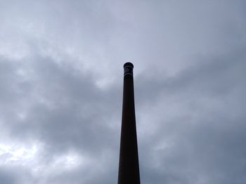 Low angle view of smoke stack against sky