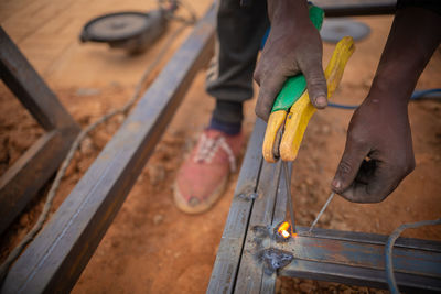 High angle view of man working on wood