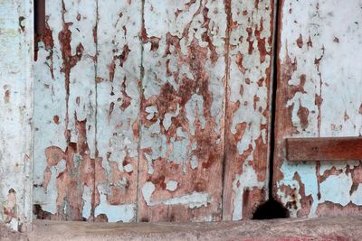 Closed wooden door of abandoned house