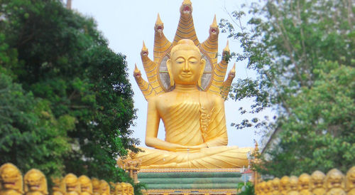 Statue of temple against trees