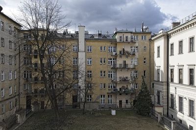 Buildings in town against sky