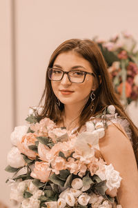 Portrait of woman with red roses