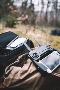 Close-up of black camera on field