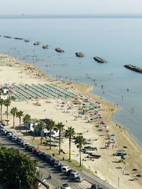 High angle view of crowded beach against sky