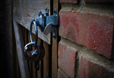 Close-up of padlock hanging on door