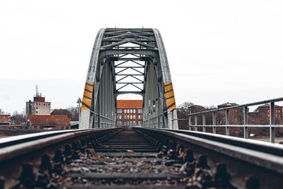 Railroad tracks against clear sky