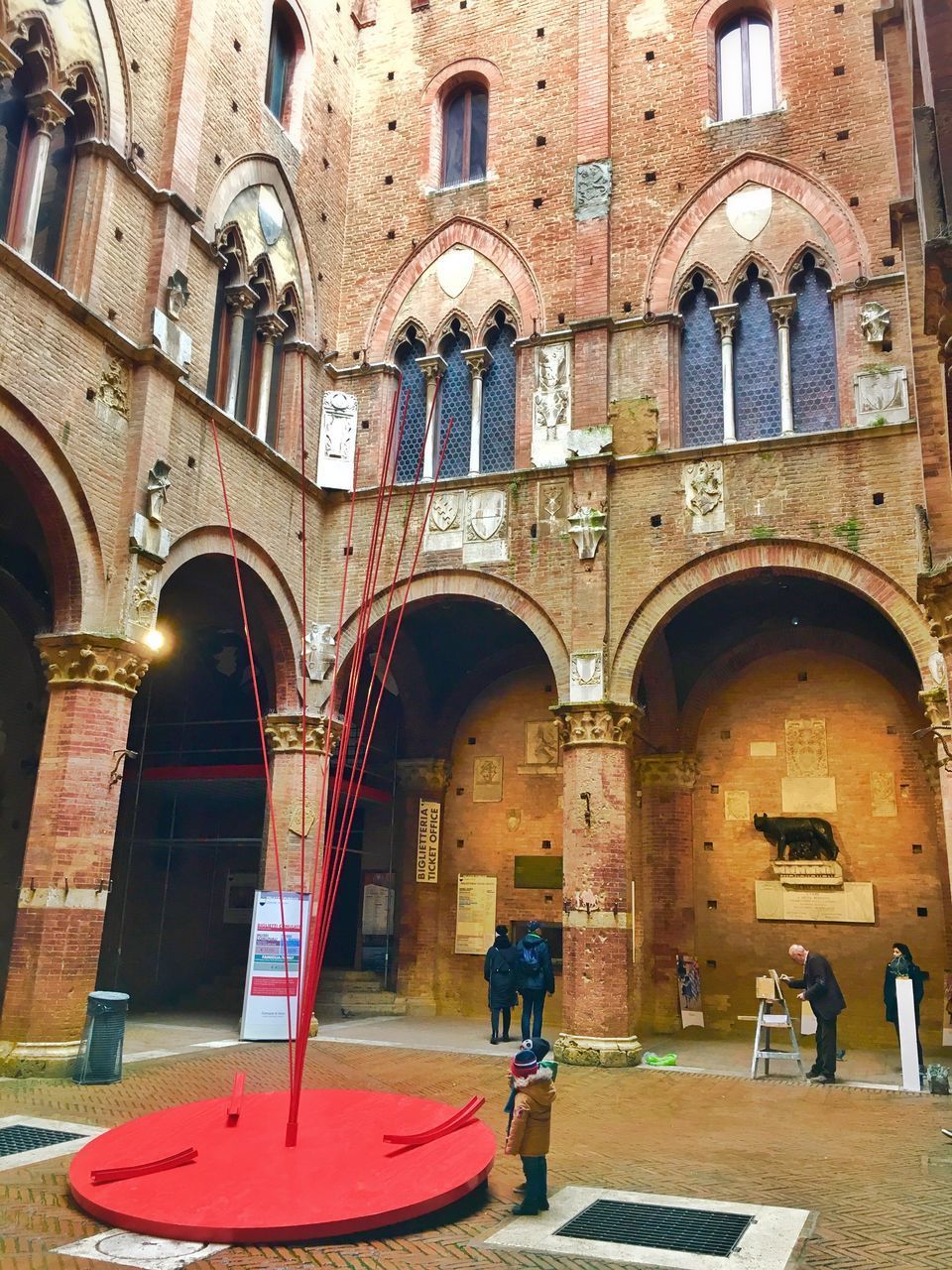 PEOPLE STANDING OUTSIDE BUILDING