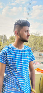 Portrait of young man looking away