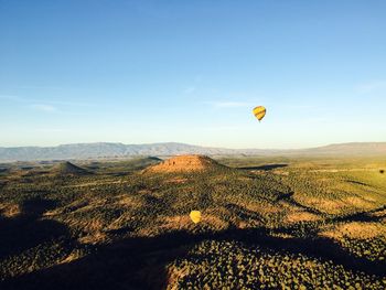 Hot air balloon over landscape