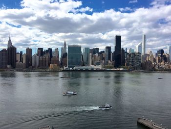 City skyline against cloudy sky