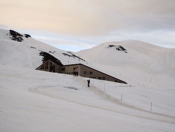 Scenic view of snow covered mountain against sky