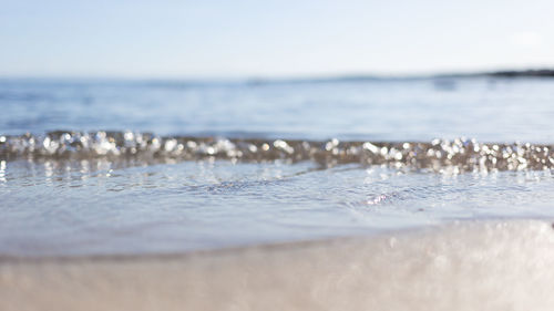 Surface level of beach against sky