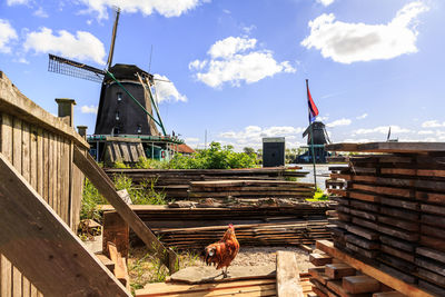 View of traditional windmill against sky