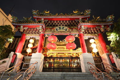 Low angle view of illuminated temple building