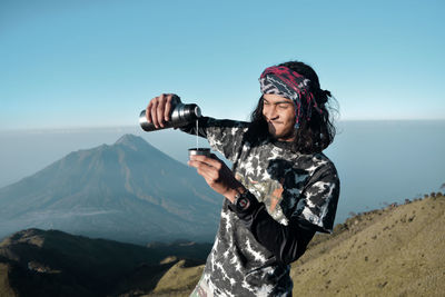 Pouring milk on the mountain. mount merbabu, central java