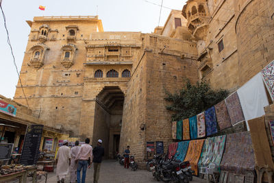 People walking in historic building