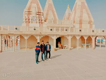 Group of people in front of historic building