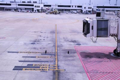 Airplane on airport runway against sky