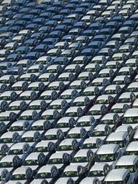 Full frame shot of white cars parked outdoors