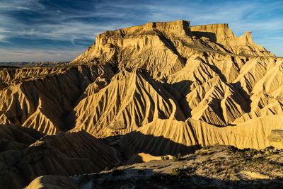 View of rock formations on landscape against sky