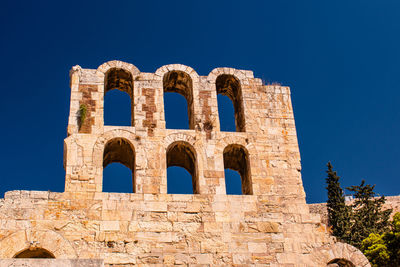 Low angle view of historical building against blue sky