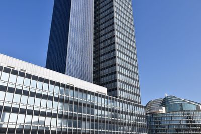 Low angle view of modern buildings against sky