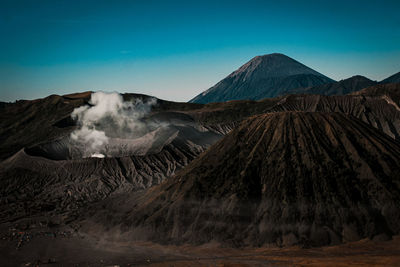 Smoke emitting from volcanic mountain