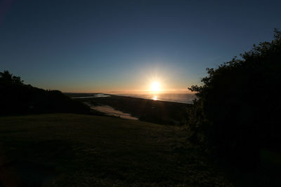 Scenic view of landscape at sunset