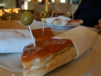 Close-up of sandwich served in plate on table