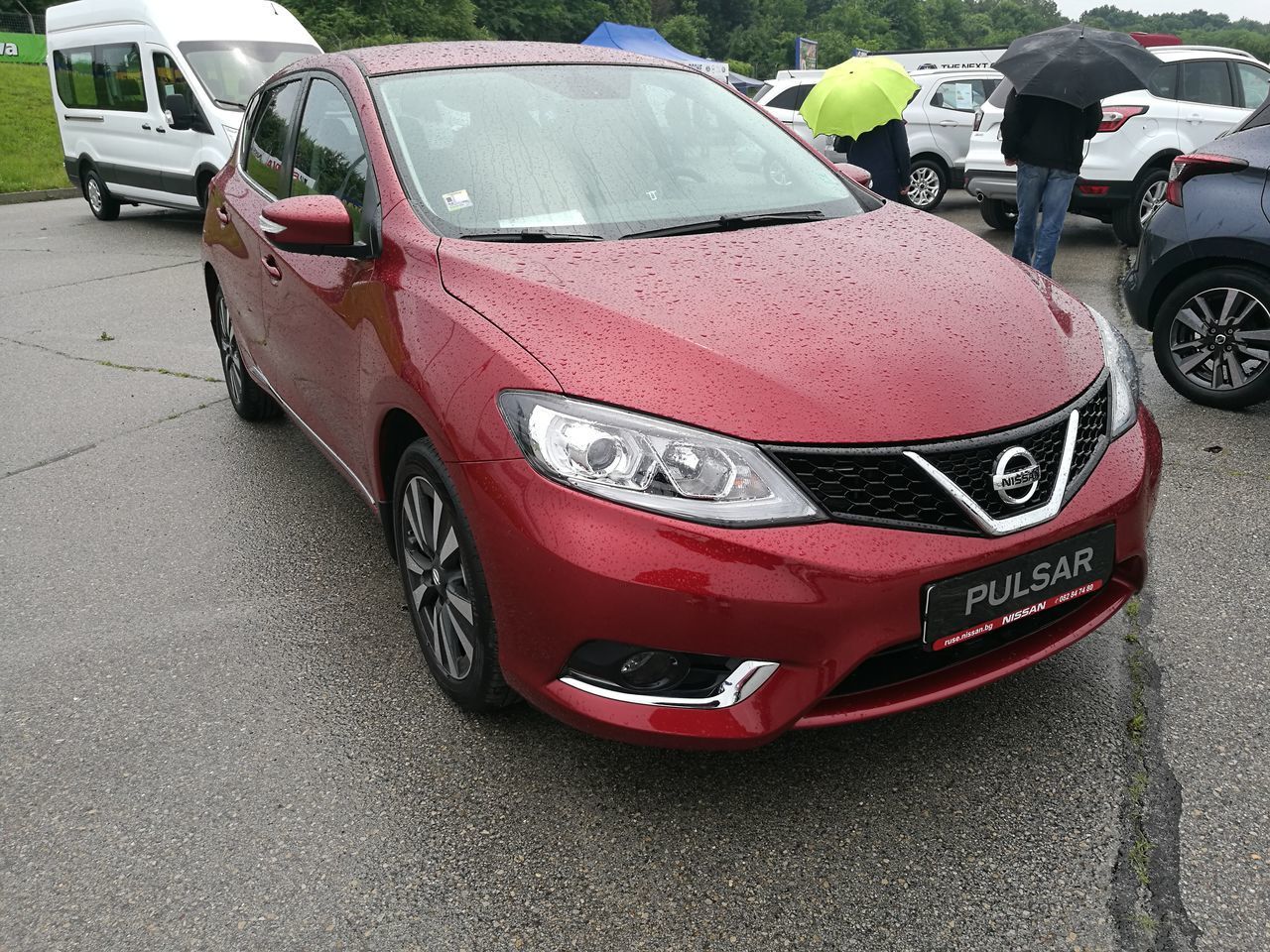 CLOSE-UP OF RED CARS ON ROAD