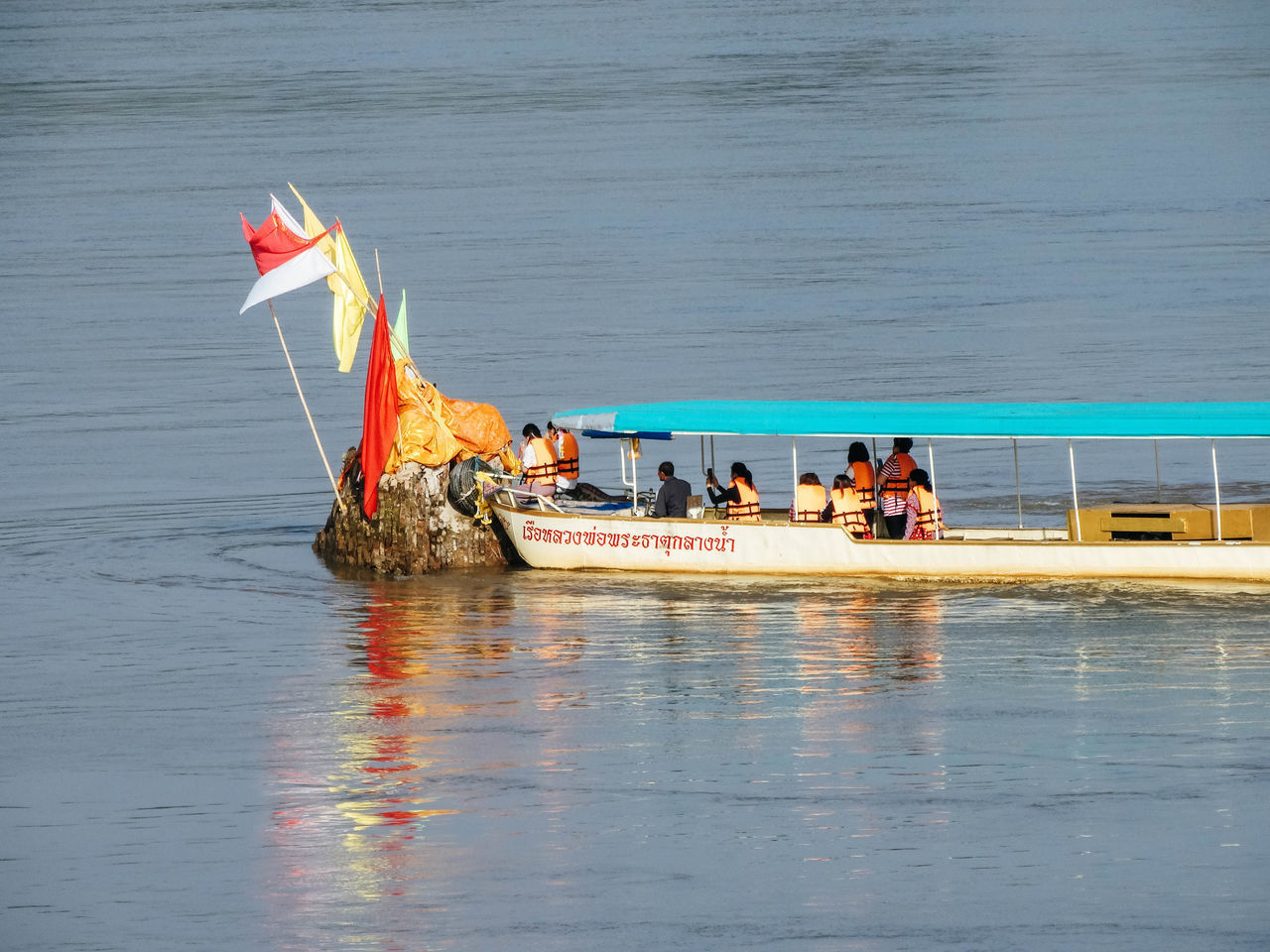 PEOPLE ON SEA AGAINST SKY