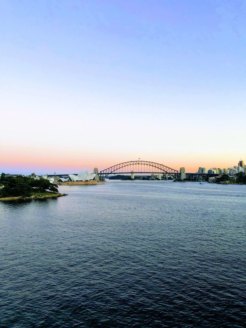 sky, water, bridge, connection, architecture, built structure, bridge - man made structure, waterfront, clear sky, no people, sunset, transportation, river, nature, city, copy space, building exterior, rippled, outdoors, arch bridge, long