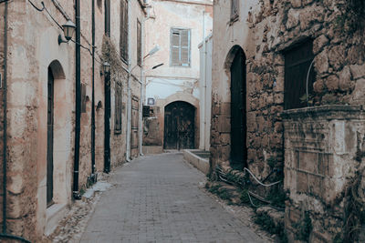 Rear view of man walking in alley