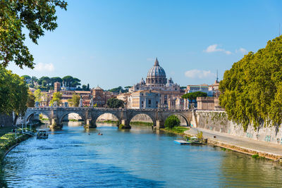 Arch bridge over river in city