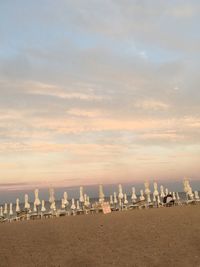 Panoramic view of beach against sky during sunset