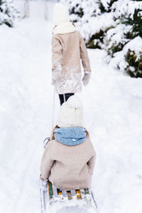 Rear view of hat on snow covered field